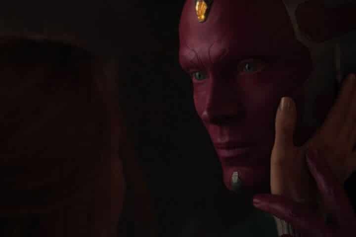 Vision touches Wanda's hand on his face