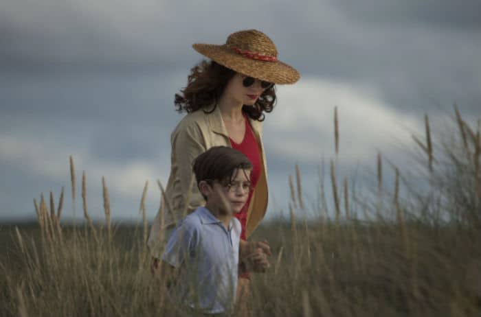 Vera Claythorne walking with her young charge, Cyril in And Then There Were None