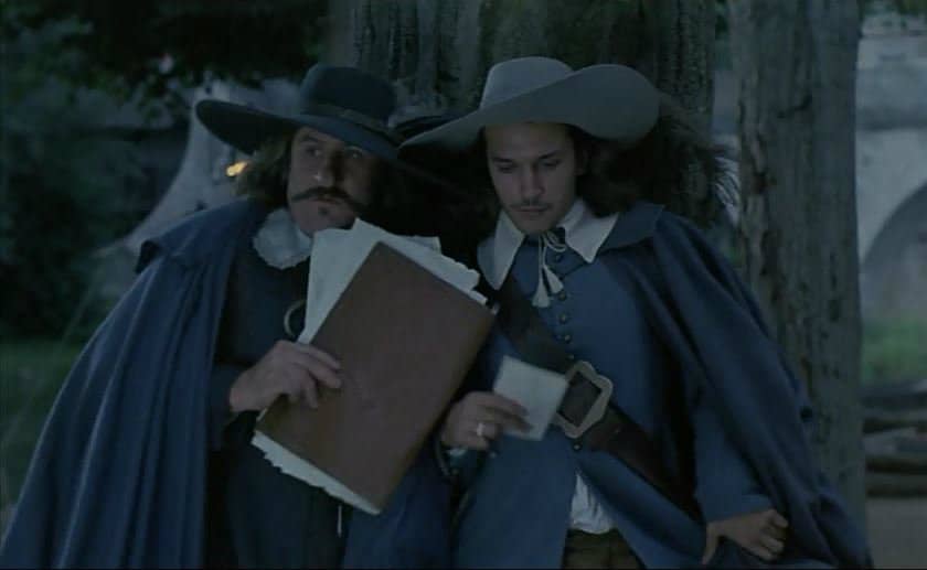 Cyrano and Christian hide from Roxanne in Cyrano de Bergerac