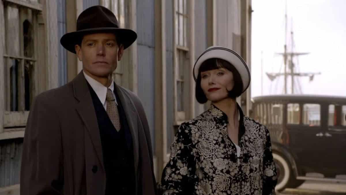 Jack and Miss Fisher standing outside together.