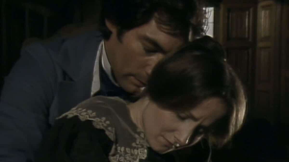 Jane Eyre 1983 photo of Mr. Rochester and Jane. He catches her from behind.