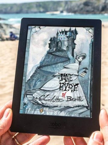 Jane Eyre Discussion Questions Featured image with Gothic Jane Eyre book cover and a beach background