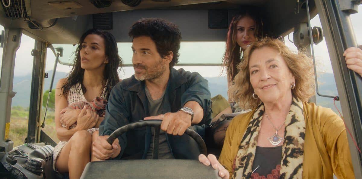 Land of Women cast. Santiago Cabrera drives with three women sitting around him.