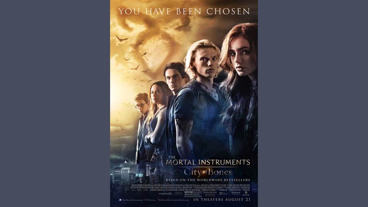 Mortal instruments city of bones review featured image. Shows the movie poster with a blue background