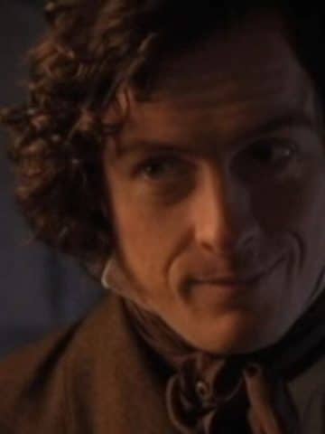 Mr. Rochester smiles at Jane.