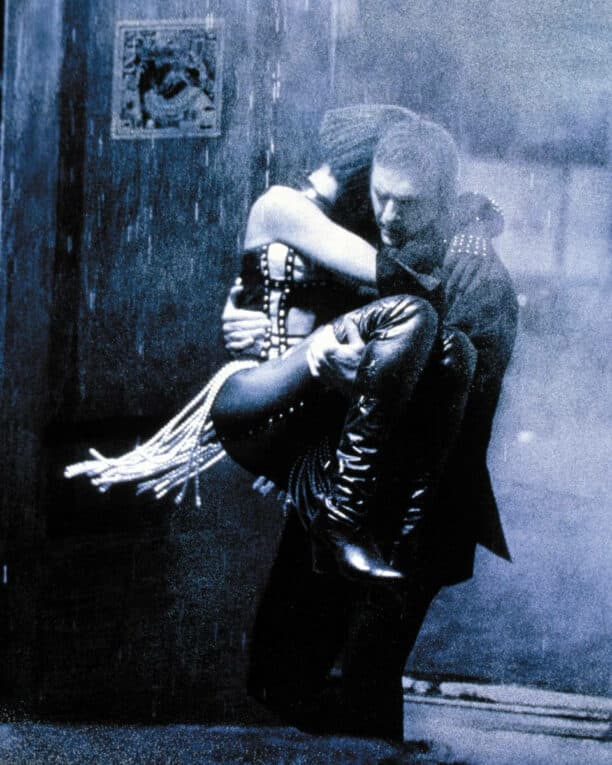 The Bodyguard promo art of Frank carrying Rachel