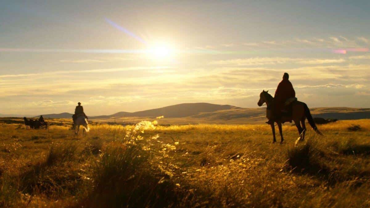 The English ending; final shot of Eli watching Cornelia ride away into the sunset.