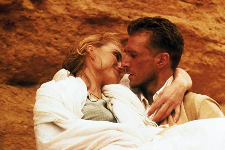 The English Patient publicity still with Kristin Scott Thomas and Ralph Fiennes. He carries her in the desert.