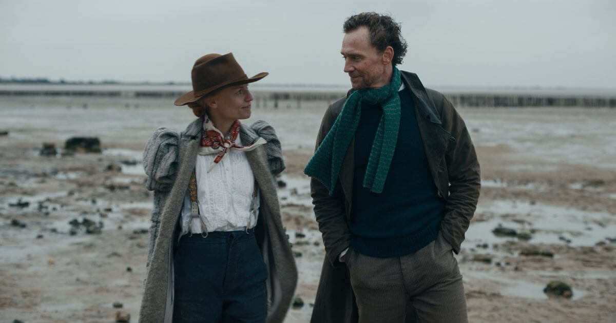 The Essex Serpent Review featured image with Claire Danes and Tom Hiddleston walking on the beach in Victorian costumes