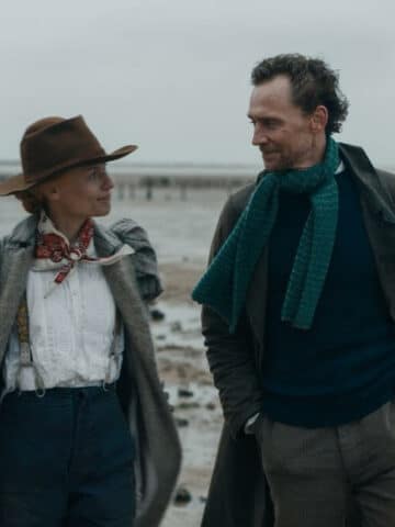 The Essex Serpent Review featured image with Claire Danes and Tom Hiddleston walking on the beach in Victorian costumes