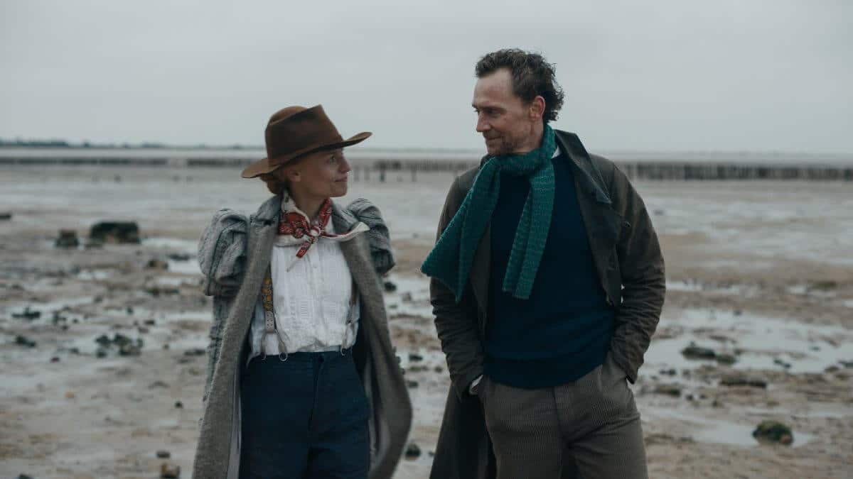 The Essex Serpent Review featured image with Claire Danes and Tom Hiddleston walking on the beach in Victorian costumes