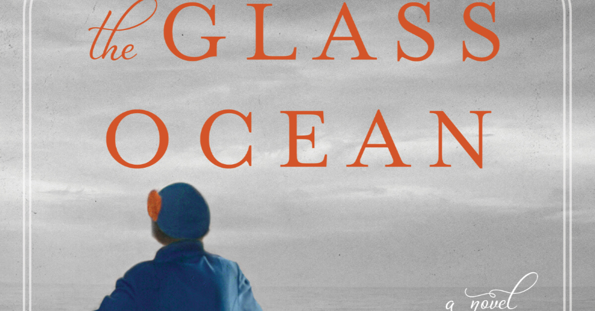 the glass ocean book cover. A woman looks out over the ocean on a boat.