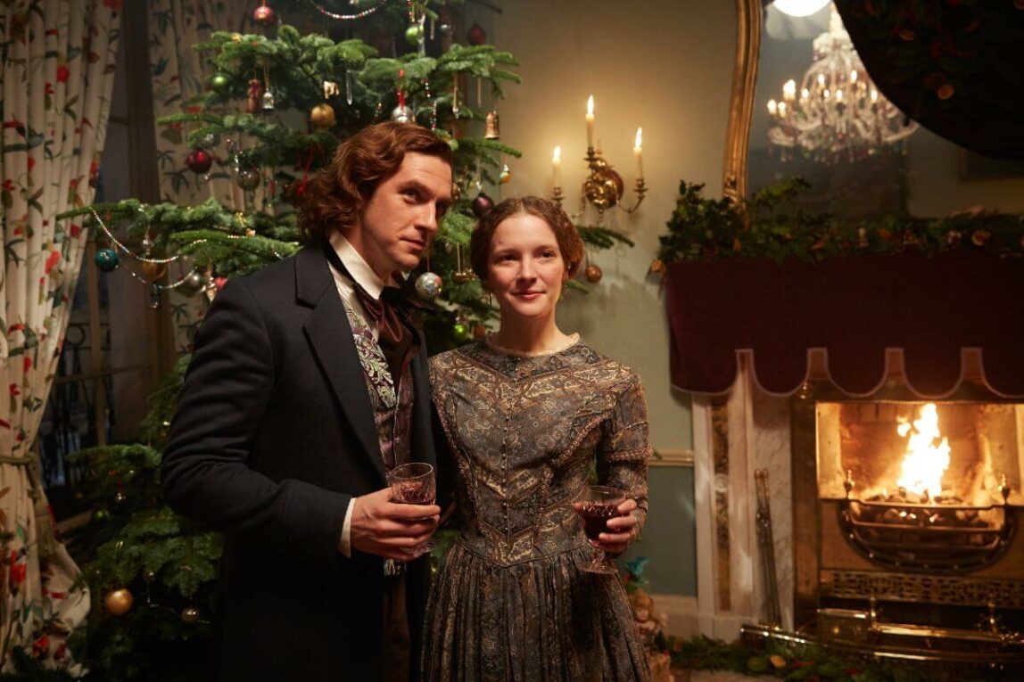 the man who invented christmas publicity still with christmas tree and couple