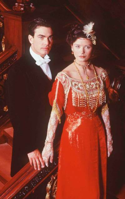 Titanic 1996 promo image with Peter Gallagher and Catherine Zeta-Jones in period costume.