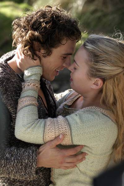 Tristan and Isolde publicity photo with James Franco and Sophia Myles. They're smiling and leaning in to kiss.